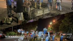 Prajurit Guskamla Koarmada II dan Warga Kompak Perbaiki Jalan di Kota Bitung